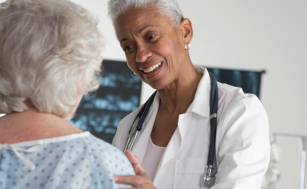 female doctor talking to patient